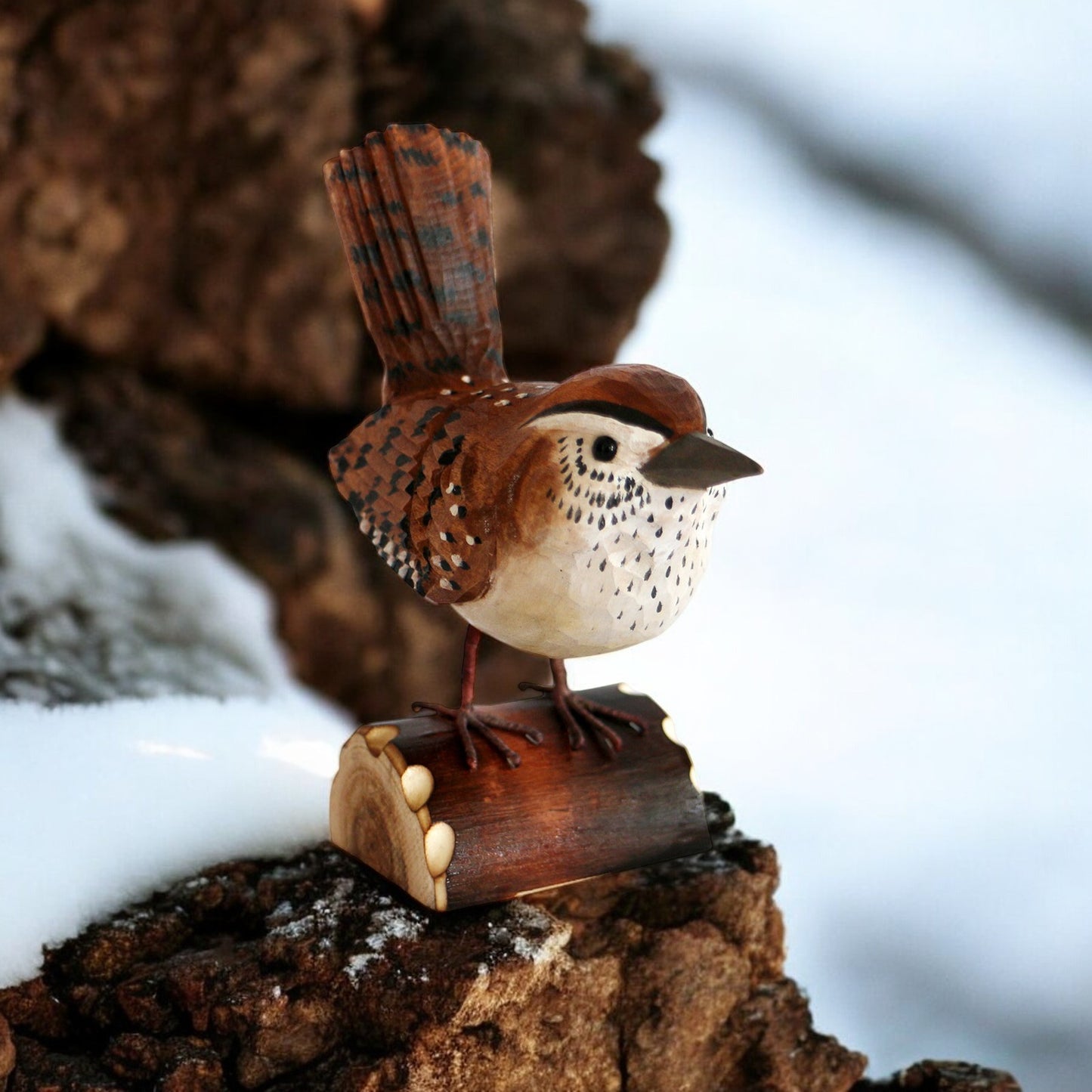 a small bird sitting on top of a piece of wood