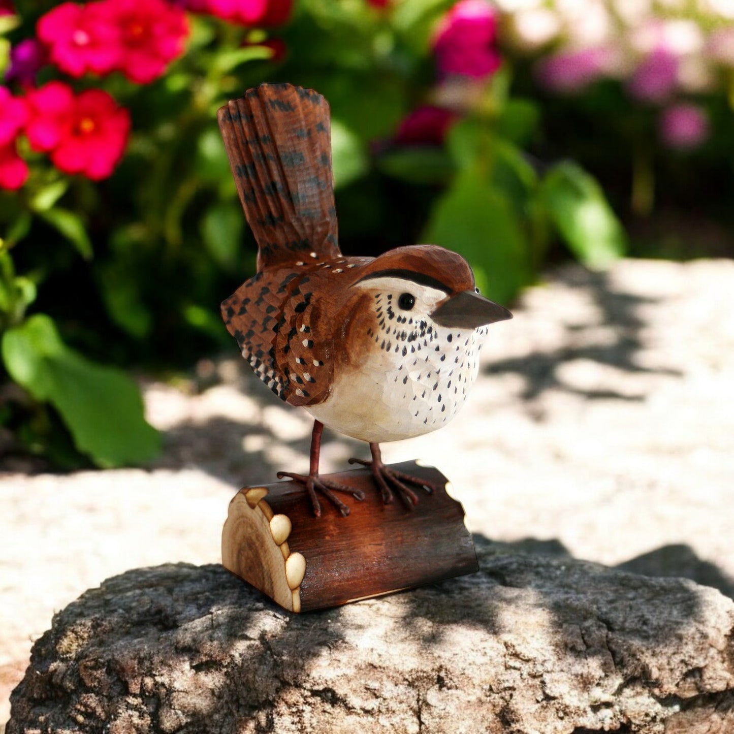 a small bird sitting on top of a piece of wood