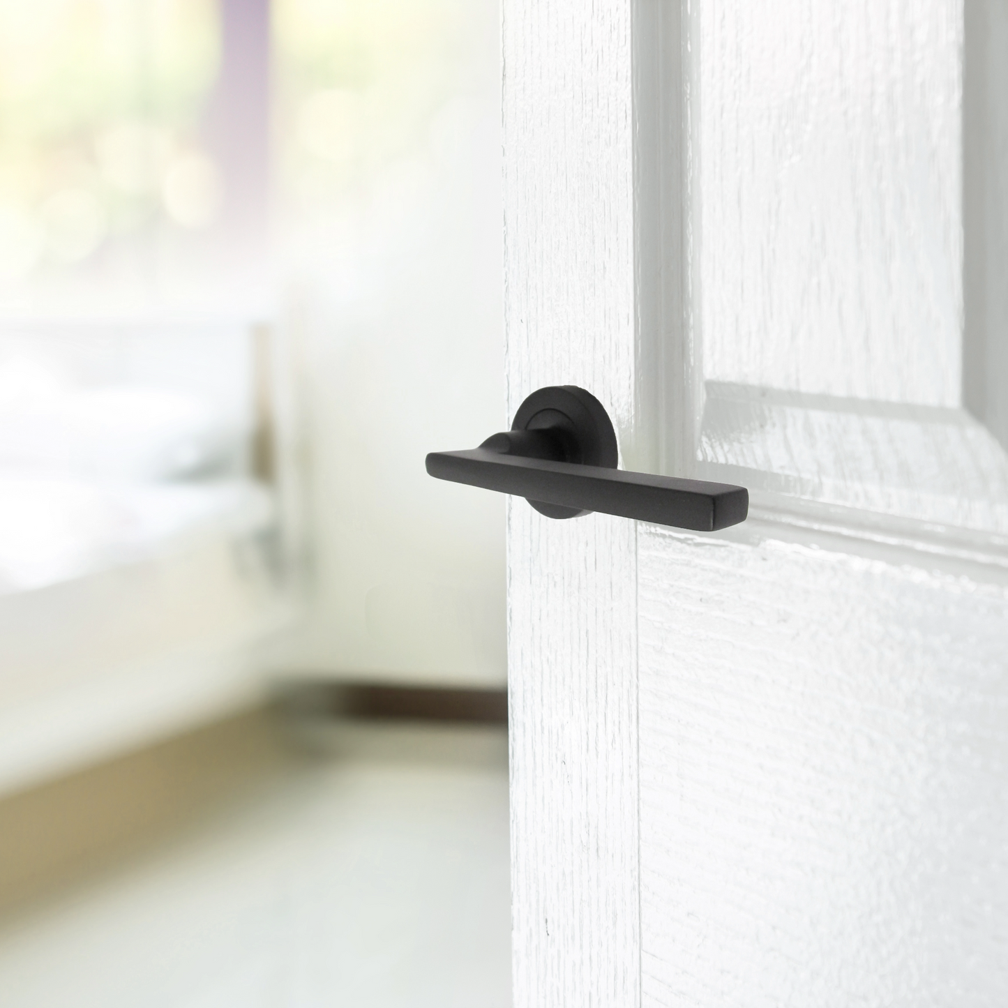 Matt Black Modern Lever on Round Rose Door Handles - 115mm handle with 52mm rose
